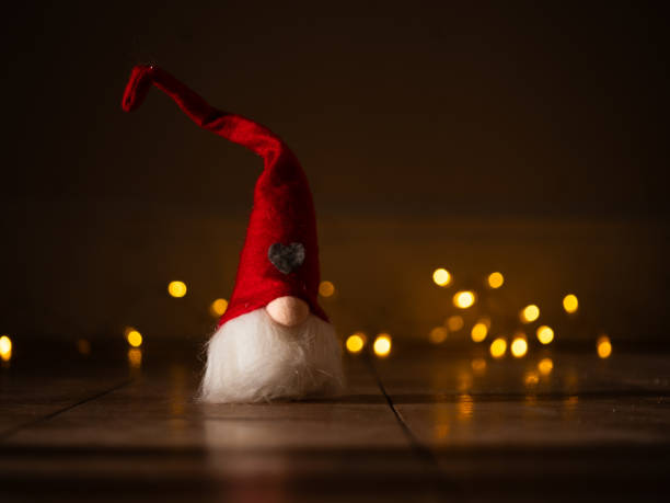 istock Christmas gnome with twinkling lights background bokeh 2186995761