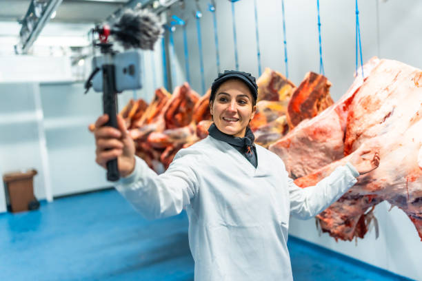 istock Vlogger talking to audience recording inside a meat factory 2187000018