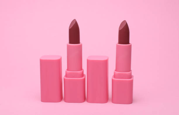 istock Pink lipstick tubes on pink background 2187000267