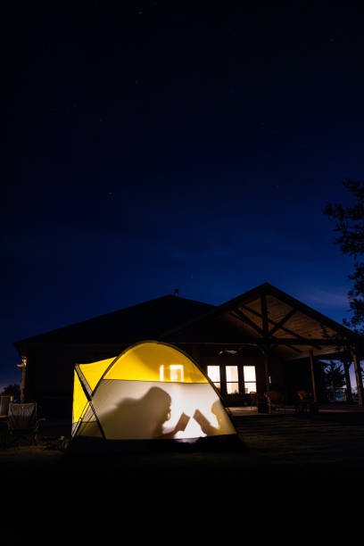 istock Young children reading books in a tent visible by their shadows 2187001679