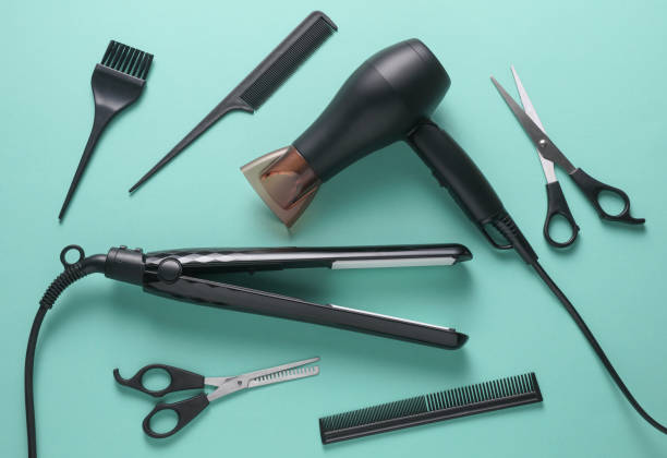 istock Flat lay hairdressing tools and accessories for hair styling on blue background. Top view 2187002056