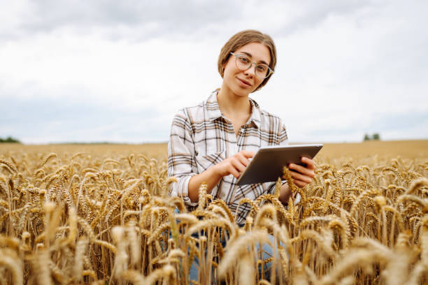 istock Smart farm. Young Female farmer with tablet in the field. 2187005920