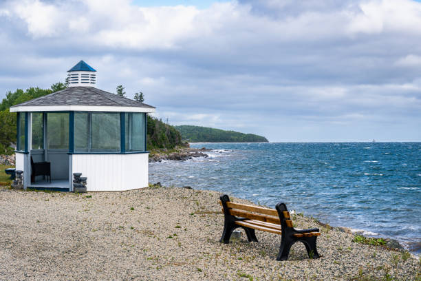 Gazebo and a bench on the ocean shoreline