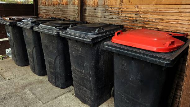 istock waste, black trash containers near the house 2187008090