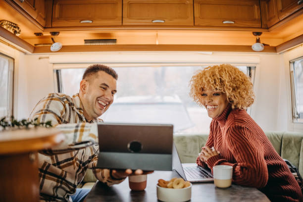 istock Couple working on laptop in camper 2187009187