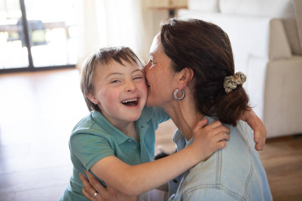 Mother and son hugging and kissing