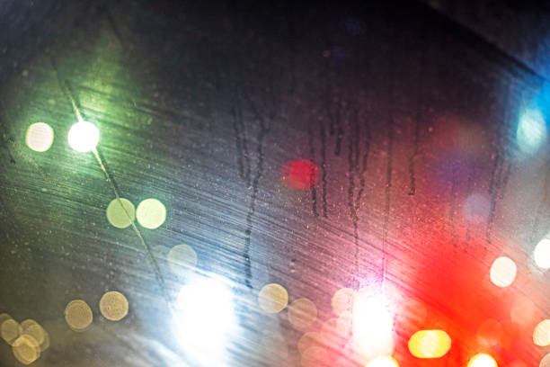 abstract background of fogged car windshield in evening lights