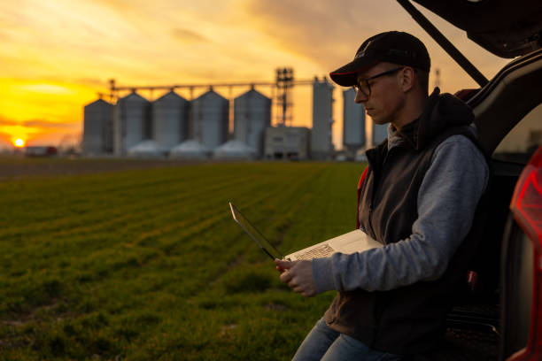 istock Caucasian Farmer Managing Crops Remotely during Sunset 2187016258