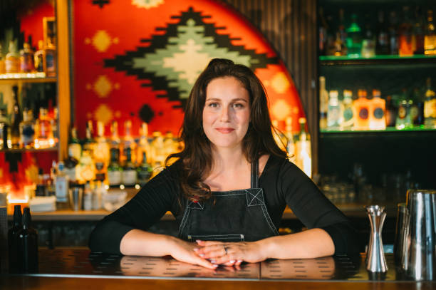 istock Smiling Female bartender 2187016627