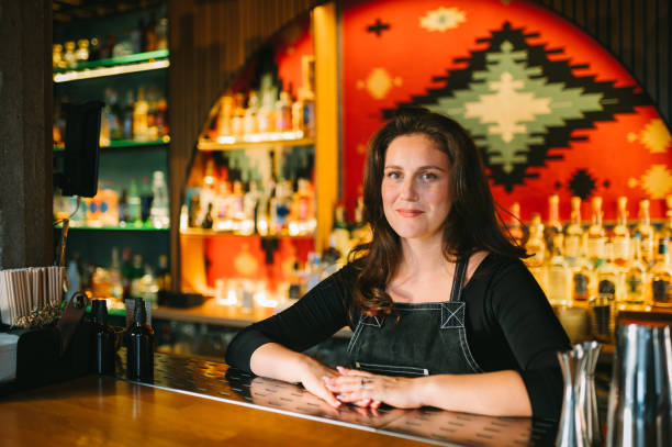 istock Smiling Female bartender 2187016628