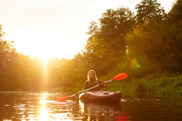 istock Experience a Serene and Peaceful Kayaking Adventure at Sunset on the Tranquil Waters 2187018000