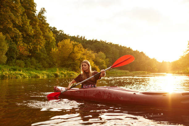 istock Experience a Serene and Beautiful Kayaking Adventure during Sunset on a Calm River Escapade 2187018016