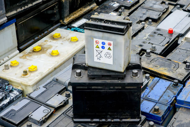 istock Stack of many used car batteries for recycling in a hazardous waste facility 2187018692