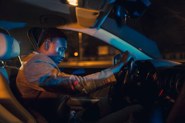 istock Man Settling in Car at Night 2187019987