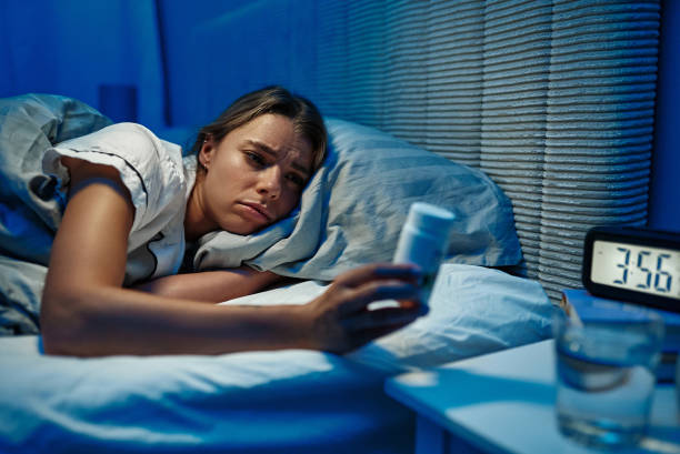 istock Late Night Wakefulness A Woman Deep in Contemplation While Lying in Bed with Thoughts 2187022914