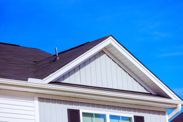 istock Modern residential roof design showcasing shingles, siding under clear blue sky 2187026419