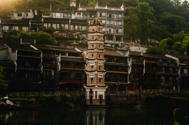 The Ancient Town of Fenghuang, located in Hunan, China, is a picturesque riverside settlement with traditional stilt houses, stone bridges, and cobbled streets. Rich in Miao and Tujia culture, it offers a step back in time with its preserved architecture and vibrant local traditions.