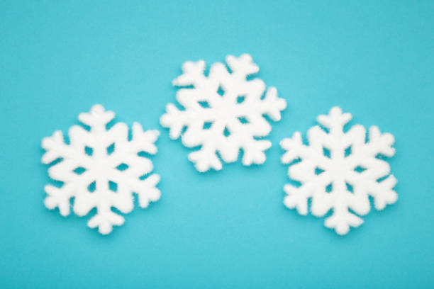 Beautiful snowflakes on blue background. Christmas
