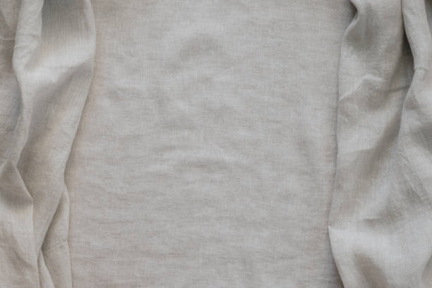 istock Abstract linen fabric texture background. Natural light brown hue dyed linen fabric background. Top view 2187028281