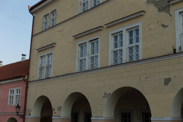 istock Historic Yellow Building with Arches and Windows in Urban Setting 2187030899