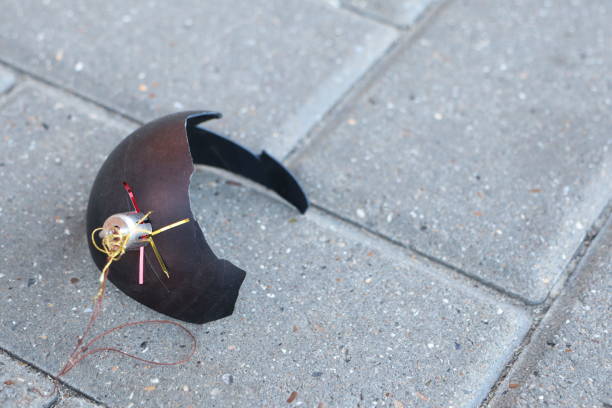 Shattered piggy bank with scattered pieces and a hammer on a blue background, symbolizing financial loss or savings depletion
