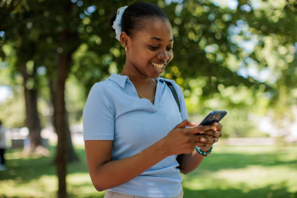 istock Woman using phone in the park 2187032458