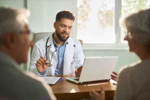istock Male doctor having a consultation with an elderly patients 2187032743