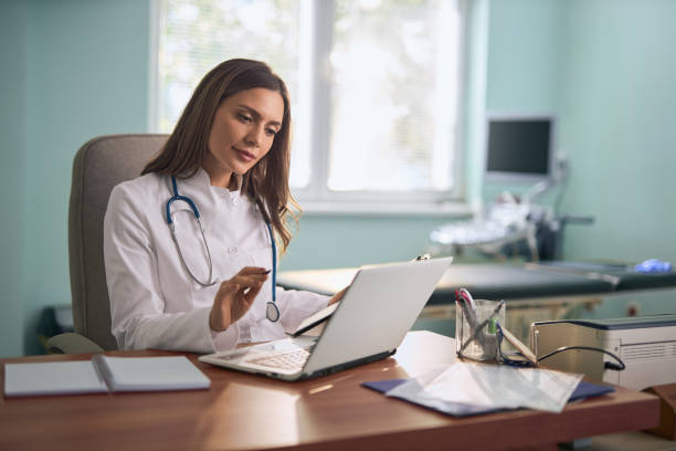 istock Female doctor working on laptop in the office. 2187032809