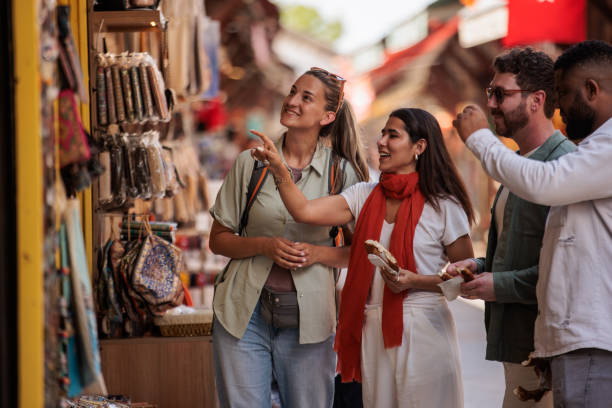 istock Tourists buying souvenirs 2187033755