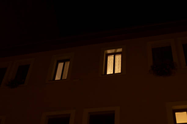 istock Nighttime Building Facade with Illuminated Windows and Dark Background 2187037914