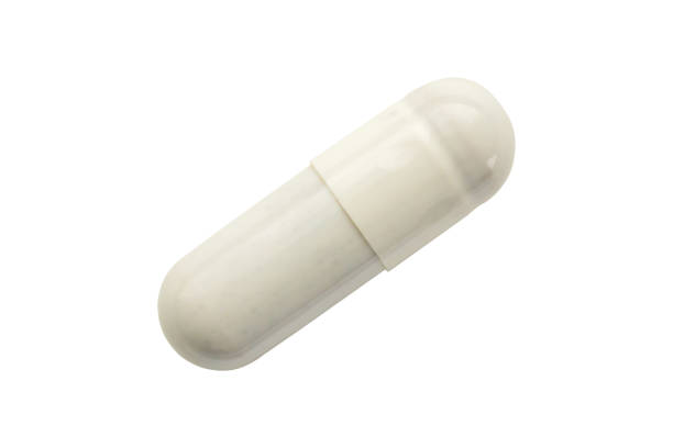 White herbal medicine capsule isolated on white background