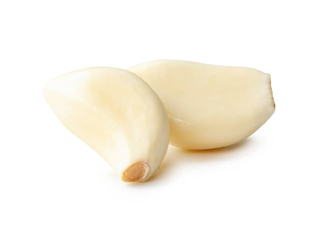 istock Side view of peeled garlic cloves in stack isolated on white background with clipping path 2187044540
