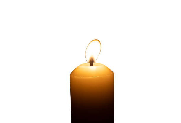 istock A single burning candle flame or light glowing on a big white candle isolated on white background with clipping path 2187045363