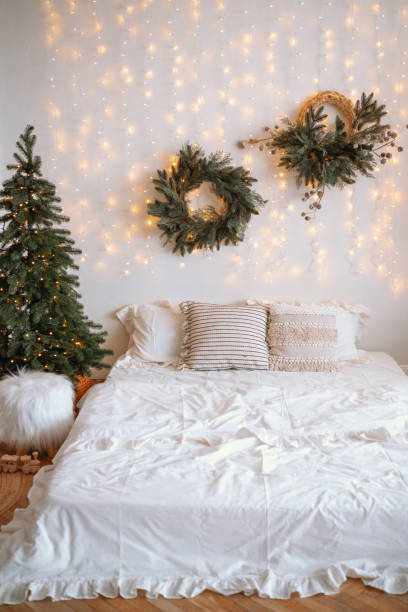 istock Cozy holiday bedroom with festive decorations and a warm atmosphere 2187045452