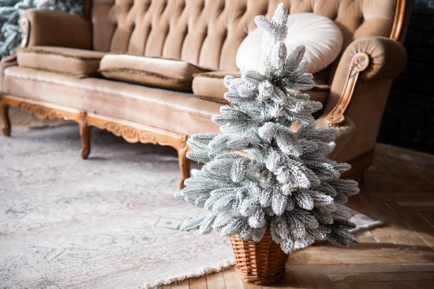istock Cozy winter living room with a decorated artificial Christmas tree 2187045456
