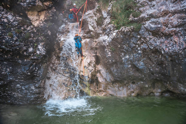 istock Black Female Slides in Canyoning Adventure 2187047288
