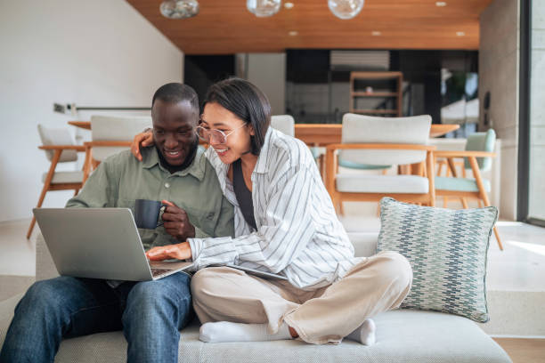 istock Joyful Friends with Tech Gadgets Enjoying Coffee at Home 2187047320