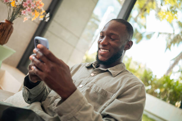 istock Cheerful Man Engaging with Technology at Home 2187047338
