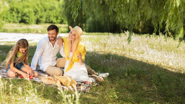 istock Happy Family Having Picnic Sitting On Blanket In Nature, Panorama 2187053708