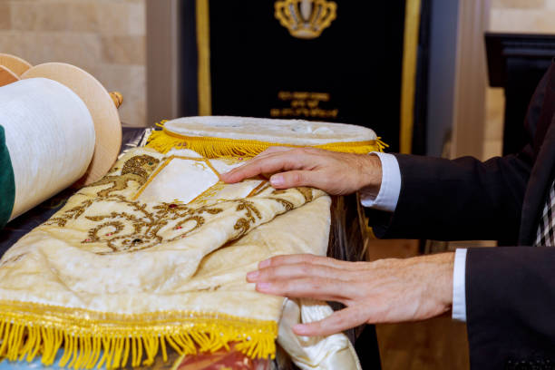 istock Ritual preparation of Torah scroll during religious service at synagogue 2187060175