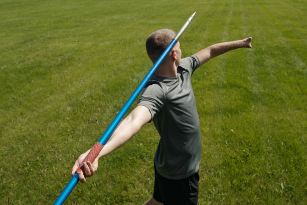 istock Throwing Javelin on Green Grass Field with Determination 2187060832
