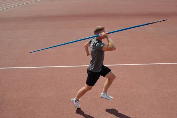 istock Athlet Preparing To Throw Javelin on Outdoor Track 2187060853