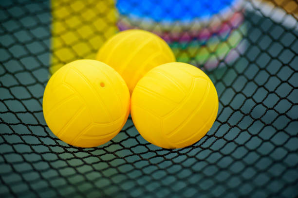 istock Bright Yellow Balls on a Sports Net 2187061682