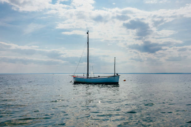 istock Small Ship Sailing in Sea at Sunny Day 2187061825