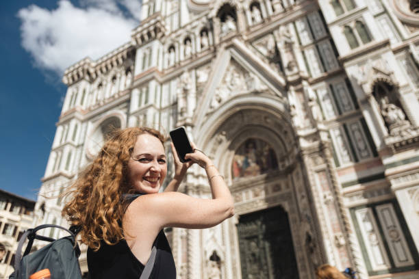 istock Smiling Tourist Photographing Florence Cathedral 2187065604
