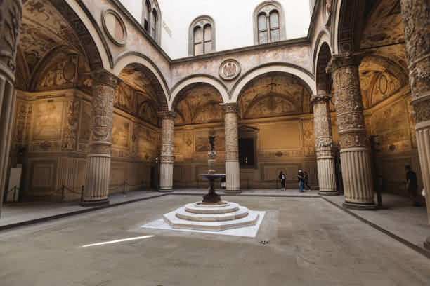 The ornate courtyard of Palazzo Vecchio in Florence, Italy, adorned with Renaissance frescoes, intricate columns, and classical sculptures. The detailed architecture and artistic embellishments highlight the grandeur of this historic landmark, offering a glimpse into the rich cultural heritage of Florence.