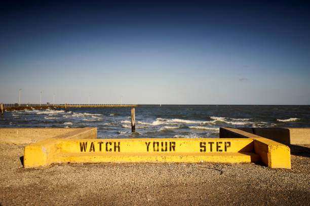 istock A bright yellow caution sign reads Watch Your Step. 2187066395