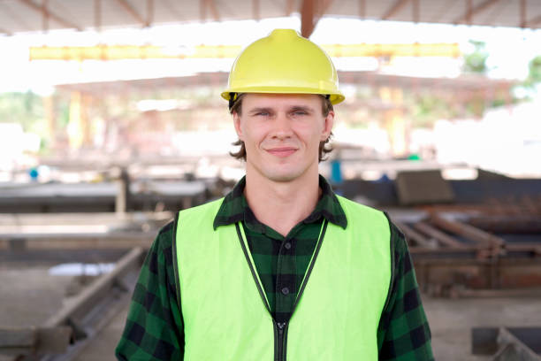 istock Caucasian male engineer looking at the camera portrait at construction. 2187066489