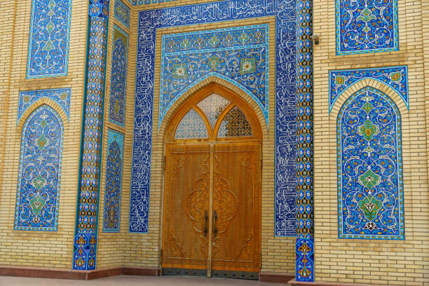 Damascus, Syria: the interior of the Sayyidah Ruqayya Mosque is renowned for its exquisite decoration, which blends Islamic artistry with a deeply spiritual atmosphere. The walls and ceilings are adorned with intricate mirror mosaics, creating a dazzling effect as light reflects off their surfaces. Delicate arabesque patterns and Quranic inscriptions, meticulously crafted in gold and turquoise hues, enhance the sacred ambiance.