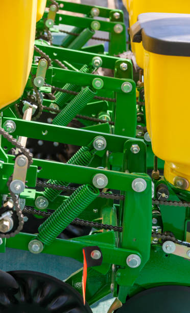 planter mechanism close up, row unit, with an optimized system with the pivoted fertilizer opener for tractors in agriculture, inner components of agricultural machinery